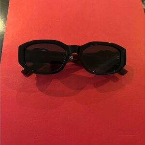 Chic bergundy  Sunglasses with black lens.